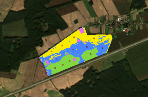 : Based on satellite imagery, ScanWorld provides an in-depth analysis of every crop: identifying the zones with consistent SOC levels (coloured zones) based on which an optimal choice of the positions where to take soil samples can be made (red circles, as an example). Copyright: ScanWorld. Satellite imagery from Copernicus’ Sentinel 2