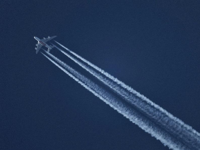 Above: An aircraft creating a condensation trial (contrail)